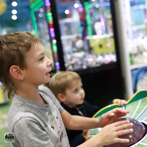 Kids playing at the Bowling Barn arcade