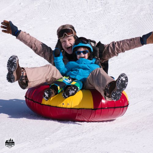 family snow tubing down Big Bear Snow Play