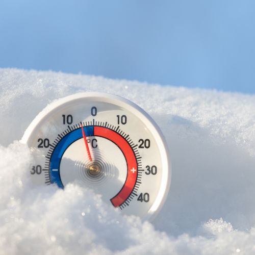 snow background with round thermostat