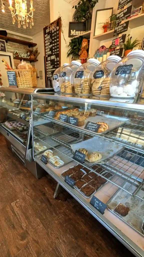 Display case filled with fresh pastries, cookies, and brownies at Sister My Sister Bake Shop in Big Bear.