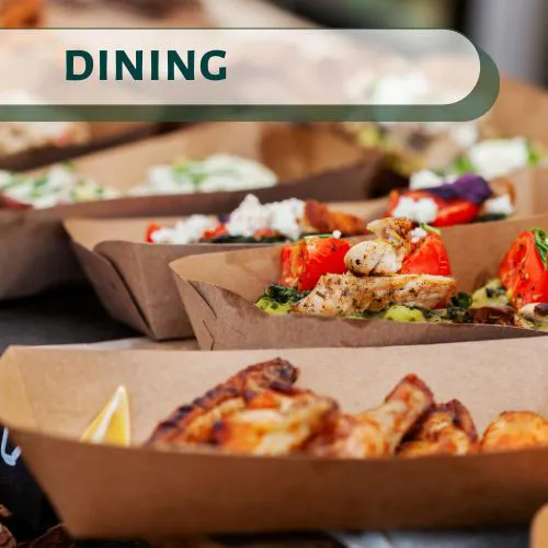 Assorted gourmet street food served in eco-friendly trays at a Big Bear Lake restaurant.