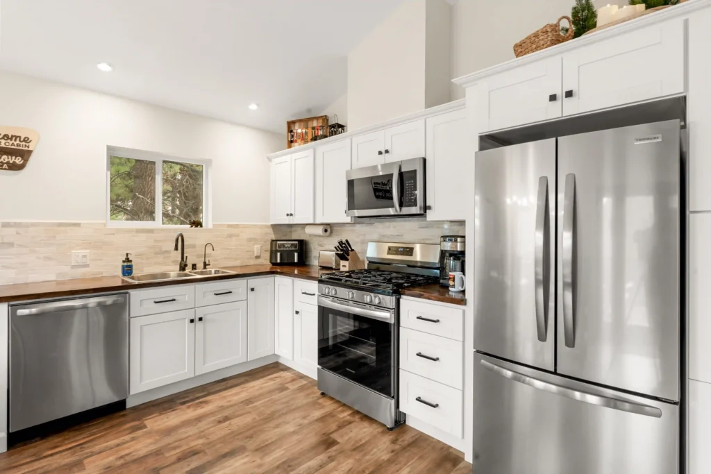 Stainless steel appliances in modern clean kitchen at Minton Grove Cabin in Big Bear Lake