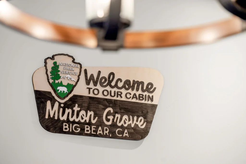 Sign on wall with Welcome to MintonGrove Cabin in Big Bear Lake CA