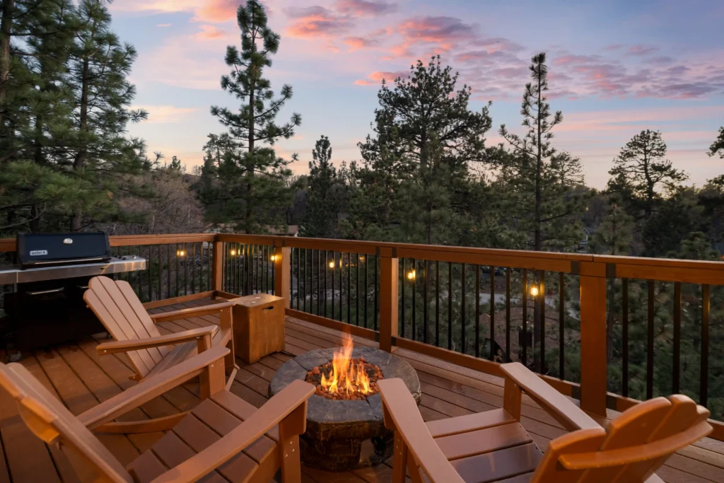 firepit with fire on balcony at Minton Grove Cabin