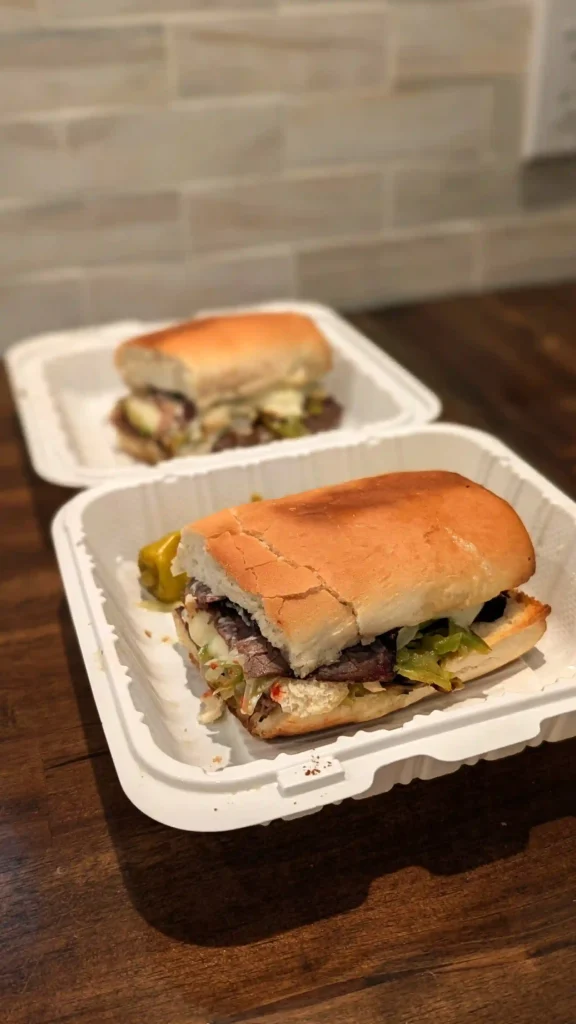 Toasted Philly sandwich with sliced roast beef, mozzarella cheese, sautéed peppers, and onions from Maggio's Pizza Big Bear Lake, CA